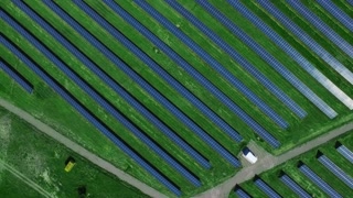 Aerial landscape with solar cells for renewable energy. Aerial view rows of photovoltaic solar panels on field. Ecology power industry