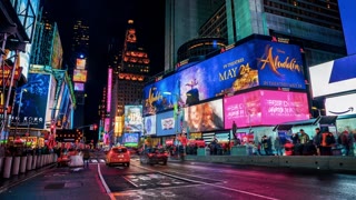 Cars, Traffic and People Crowd Rushing at Times Square at Night. Panoramic Time Lapse.