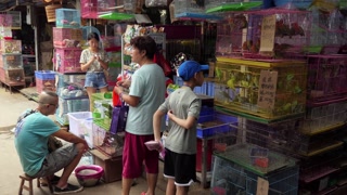 People in a shop selling animals in a traditional market of Guilin, China, Asia